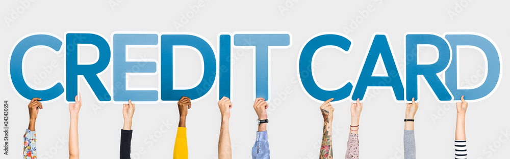 Hands holding up blue letters forming the word credit card Hands holding up blue letters forming the word credit card