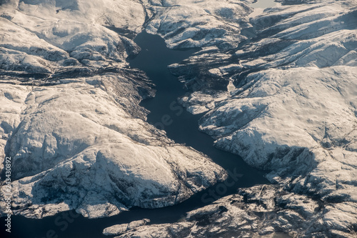 Fjord mountain range in arctic circle ocean on winter