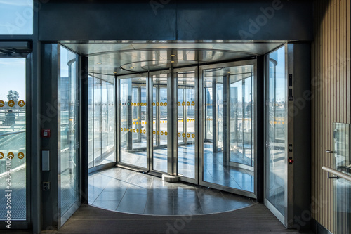 Front revolving transparent automatic rotate door photo