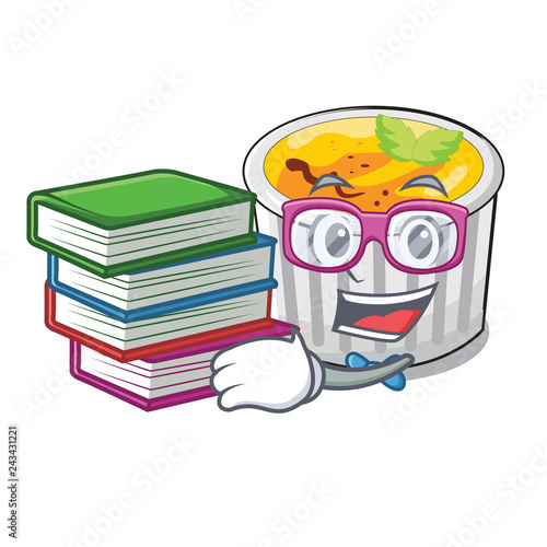 Student with book creme brulee served on mascot plate