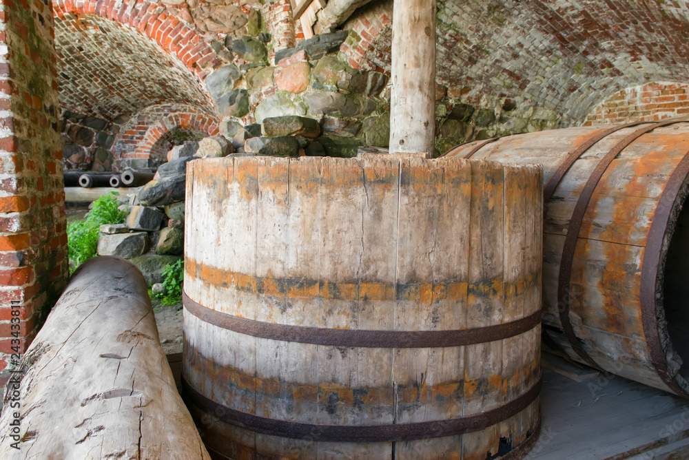 Old barrels in the Spaso-Preobrazhensky Solovetsky Monastery. Russia, Arkhangelsk region, Primorsky district, Solovki Old barrels in the Spaso-Preobrazhensky Solovetsky Monastery. Russia, Arkhangelsk region, Primorsky district, Solovki
