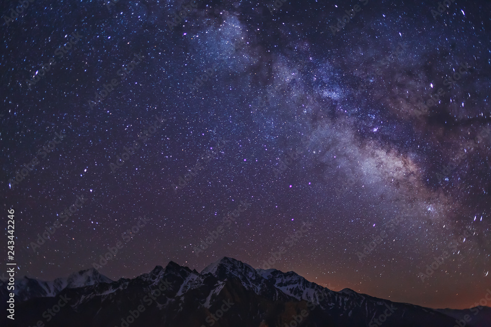 Stars and Milky Way in the clear night sky over Main Caucasian Ridge