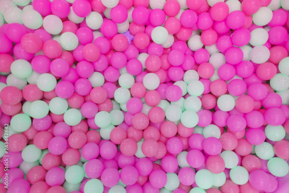 Kids ball pit or ball pool with many colorful balls as background Kids ball pit or ball pool with many colorful balls as background