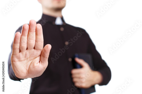 Priest extending his open palm, isolated on white background