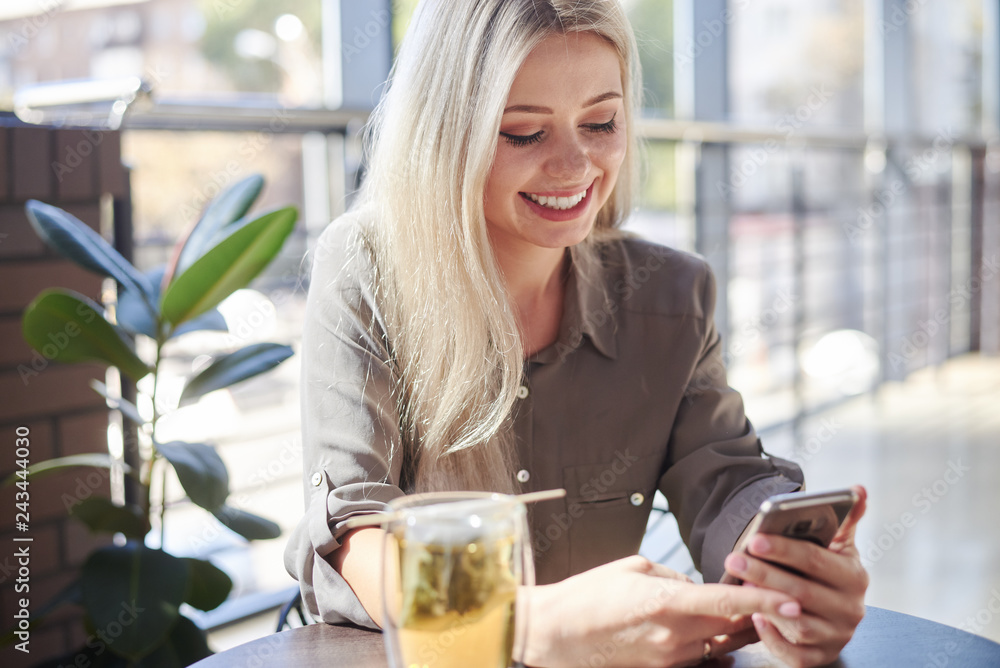 Beautiful woman using phone at cafe Beautiful woman using phone at cafe