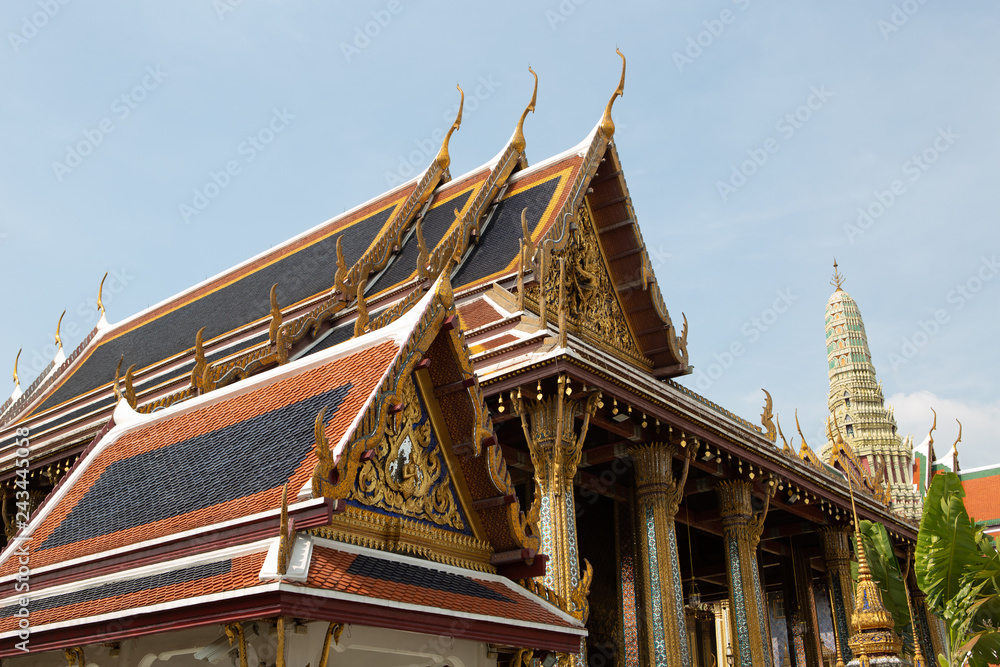 The beauty of the Emerald Buddha Temple . And while the gold of the temple catching the light. This is an important buddhist temple of thailand and a famous tourist destination. The beauty of the Emerald Buddha Temple . And while the gold of the temple catching the light. This is an important buddhist temple of thailand and a famous tourist destination.