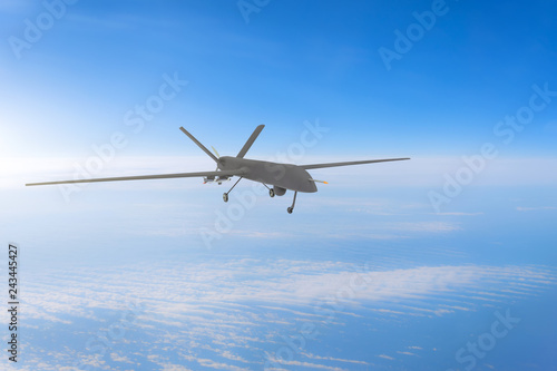 Unmanned military drone on patrol air at high altitude.