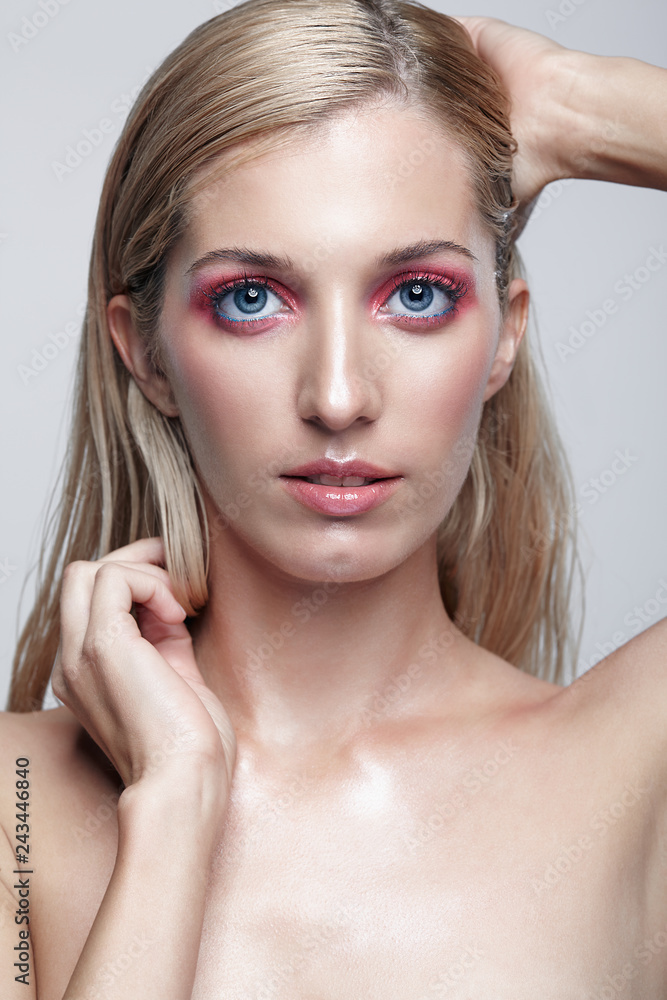 Fototapeta premium Female posing on gray background.