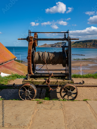 An old rope winch on the North Sea coast in Runswick Bay, North Yorkshire, England, UK photo