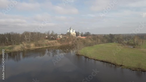 Wallpaper Mural village with a church on the high bank of the river, view from a quadcopter Torontodigital.ca