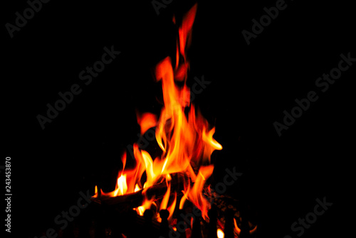 Flames in the fireplace on a black background