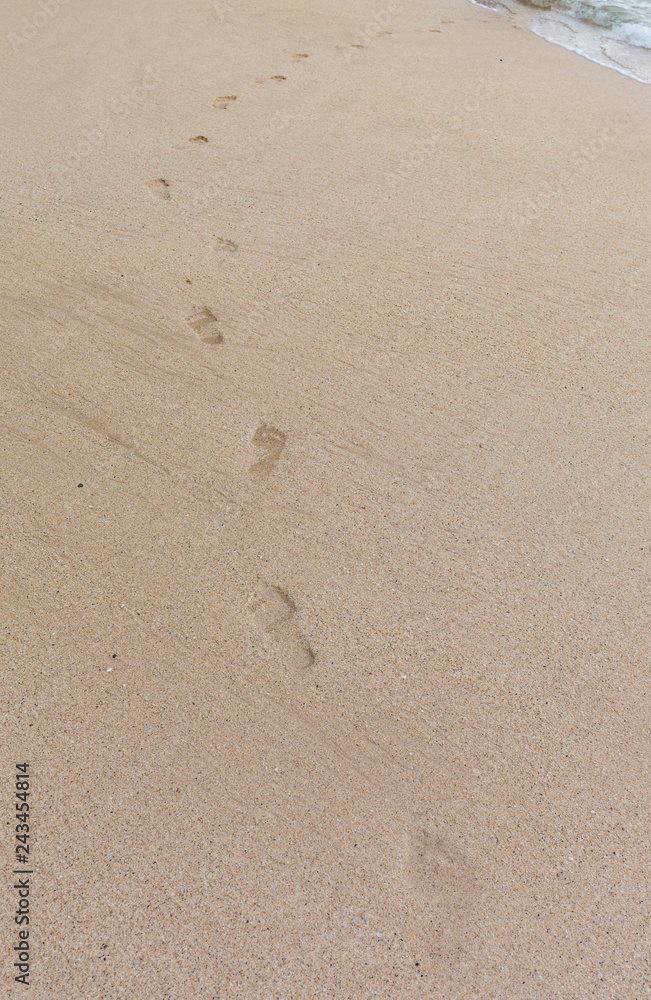 beach, wave and footprints at sunset time beach, wave and footprints at sunset time
