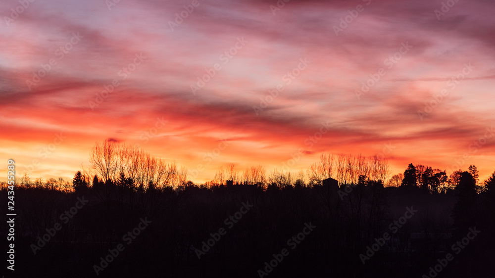 Fototapeta premium Burning dawn. Games of clouds