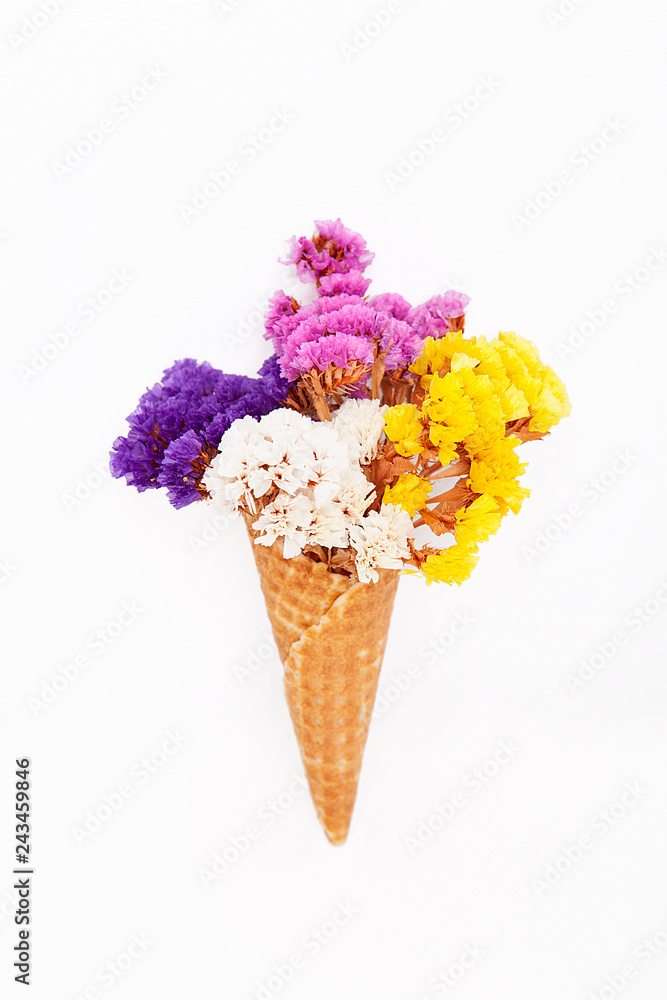 Dry flowers in ice cream cone. Rustic still life.