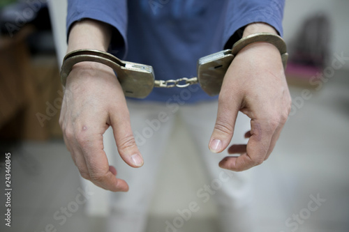 imprisoned man with handcuffs on his hands © Семен Саливанчук