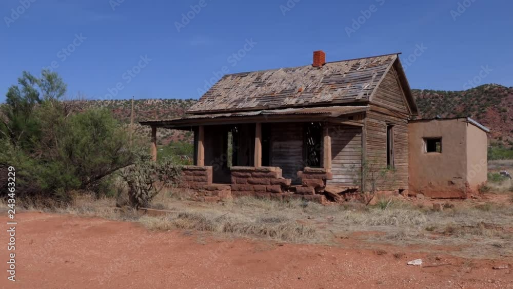 Abandoned buildings in Cuervo, ghost town of New Mexico, United States of America, along the highway Interstate 40. View of a small American village in the Southwest US. Old wooden home in the desert Abandoned buildings in Cuervo, ghost town of New Mexico, United States of America, along the highway Interstate 40. View of a small American village in the Southwest US. Old wooden home in the desert