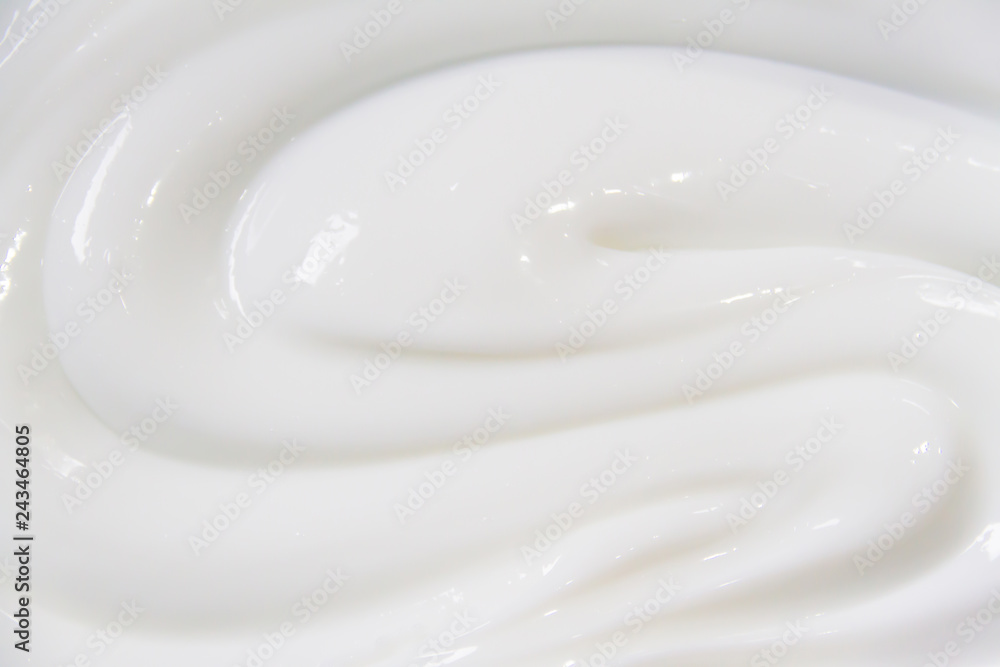 The white surface of the cream lotion softens the background. - obrazy, fototapety, plakaty 