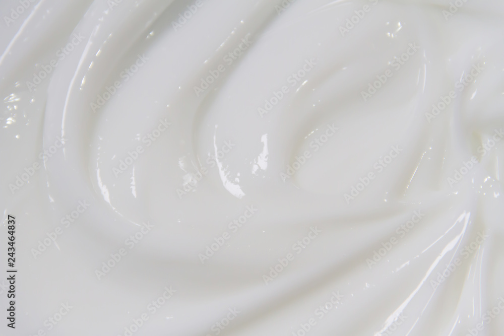 The white surface of the cream lotion softens the background. The white surface of the cream lotion softens the background.