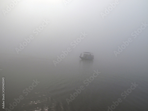 Misty morning on the holiest of rivers in India. Ganges delta in Sundarbans, West Bengal, India  photo