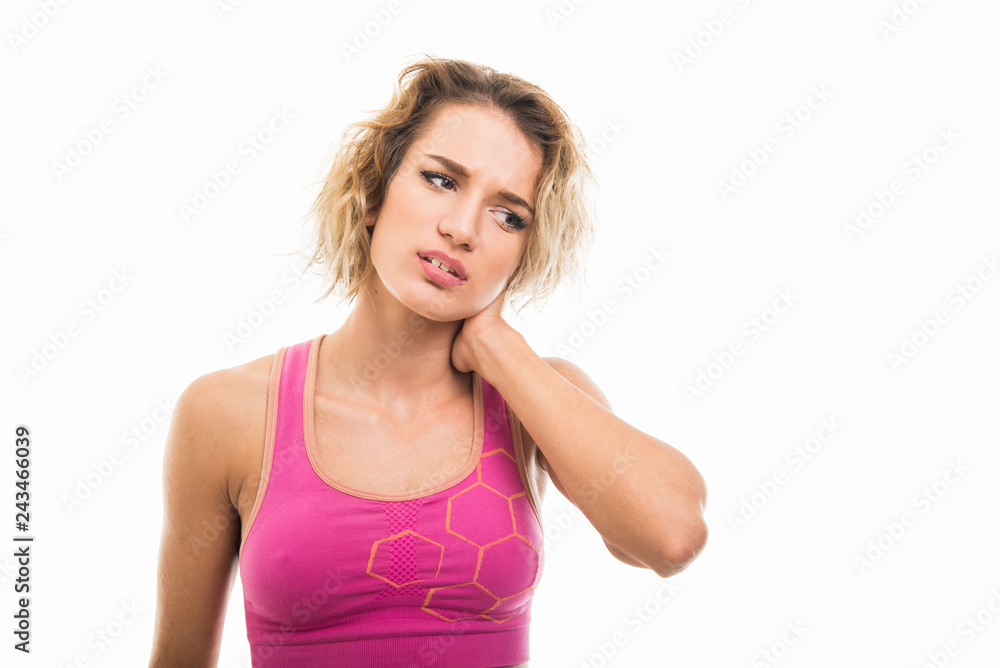 Portrait of beautiful young fit girl holding neck like hurting Portrait of beautiful young fit girl holding neck like hurting