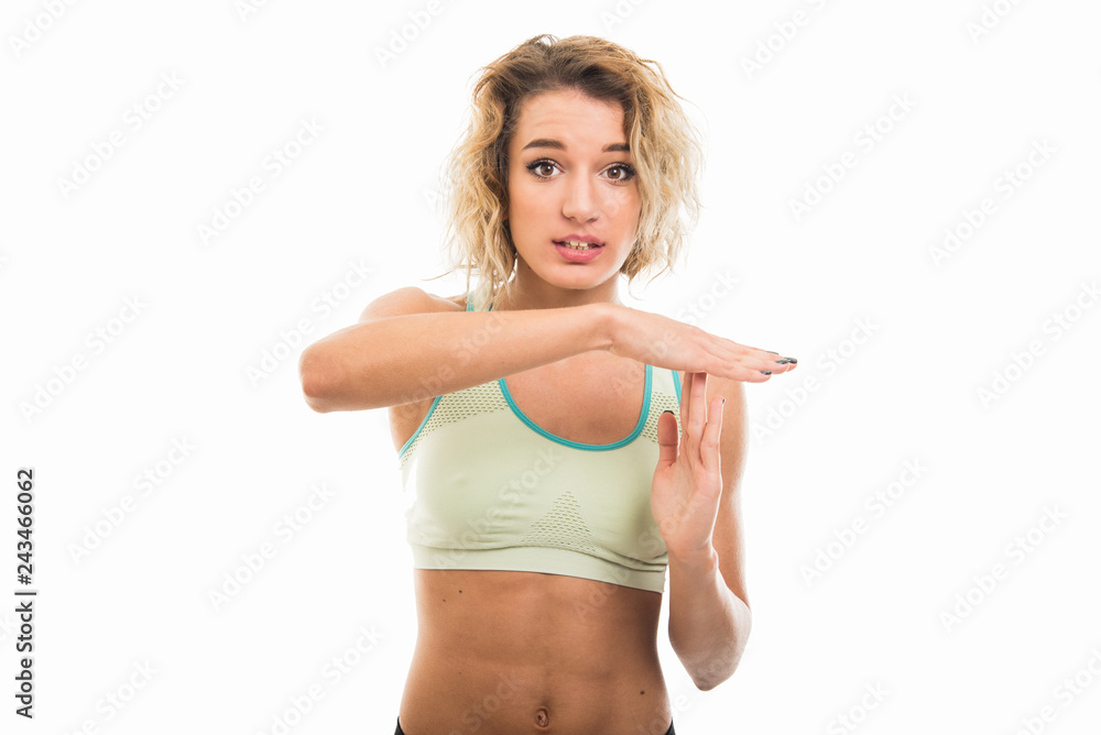 Portrait of beautiful young fit girl showing time out gesture Portrait of beautiful young fit girl showing time out gesture