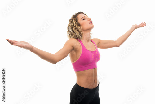 Side view of fit girl standing with arms spread