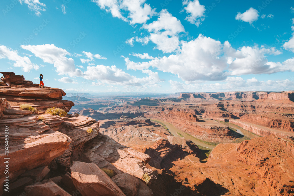 Hiker on a cliff in Dead Horse Point State Park, Utah, USA