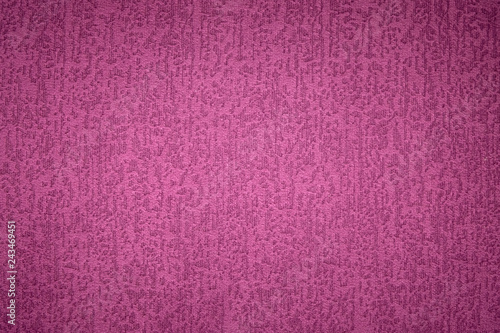 Textured background surface of textile upholstery furniture close-up. magenta red Color fabric structure