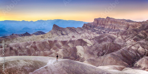 Obraz na płótnie Man watching sunset at Zabriskie Point, Death Valley National Park, California, USA w salonie
