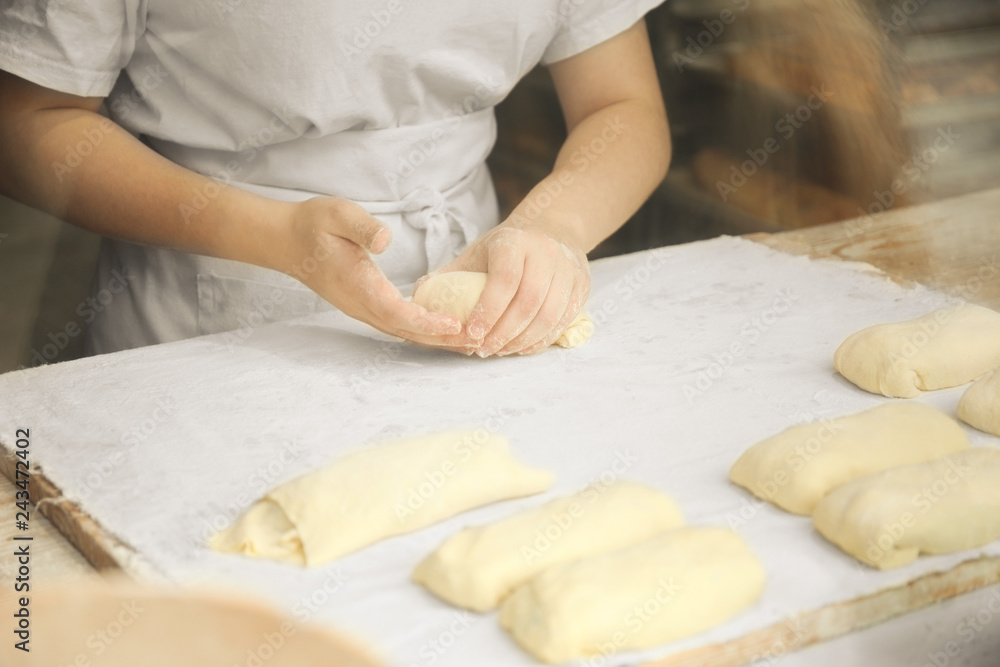 Hands of the cook gently knead dough. Little family bakery. Hands of the cook gently knead dough. Little family bakery.