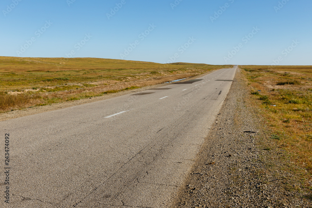 asphalt road in the Mongolian steppe, Mongolia asphalt road in the Mongolian steppe, Mongolia