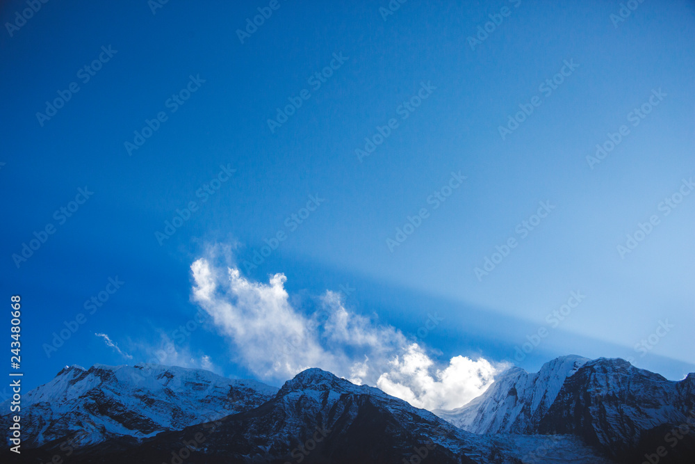 Silhouette of Himalayan mountains on blue sky. Nepal
