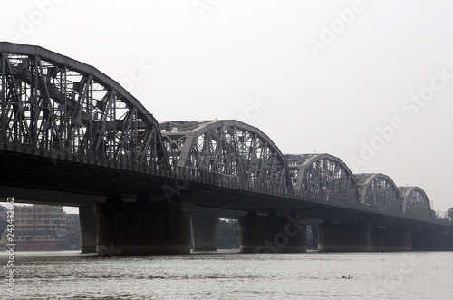 Bridge across the river, Vivekananda Setu. It links the city of Howrah, at Bally, to its twin city of Kolkata, at Dakshineswar. photo