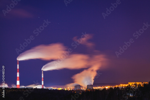 compound heat and power station at night in winter