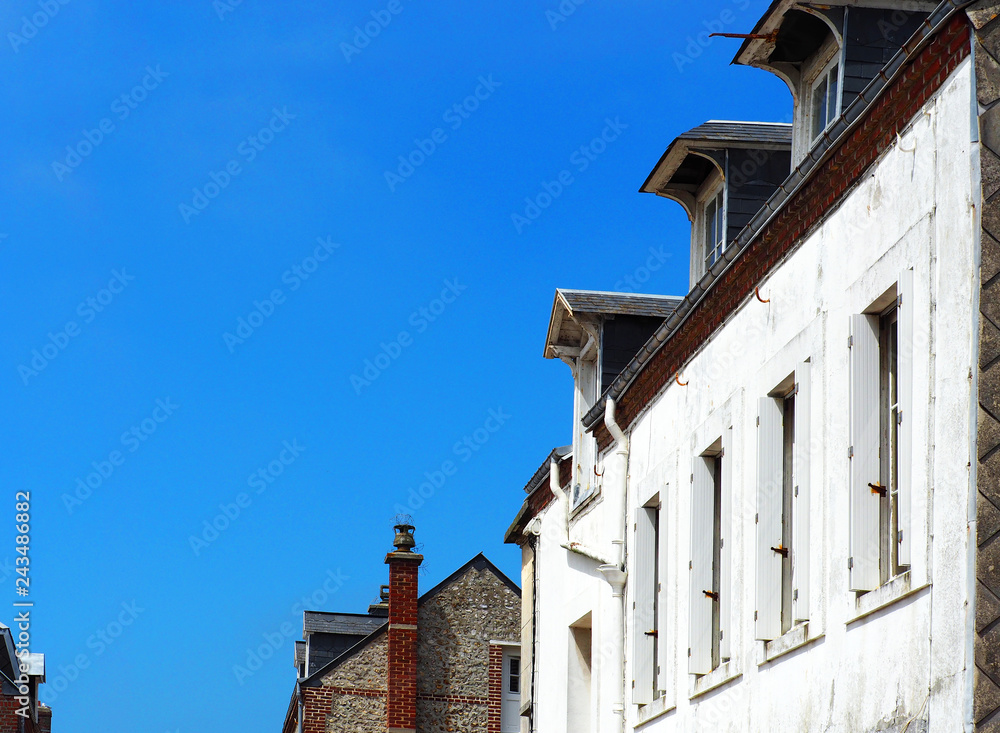 Medieval houses, sunny summer day. Picturesque landscape and architecture of Etretat, view of the ancient city, France