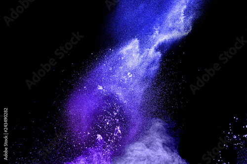 blue powder explode cloud on black background. Launchedblue dust particles splash on background.