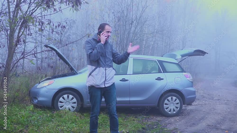 Aggressive driver of an old car yelling into the mobile phone. It's time to change the car to a new one. Aggressive driver of an old car yelling into the mobile phone. It's time to change the car to a new one.