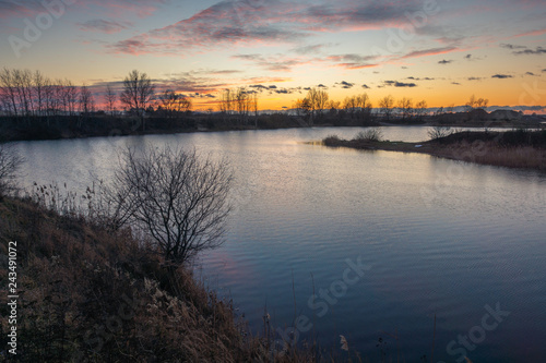 Sunset over the pond in Puchaly, Raszyn, Poland photo