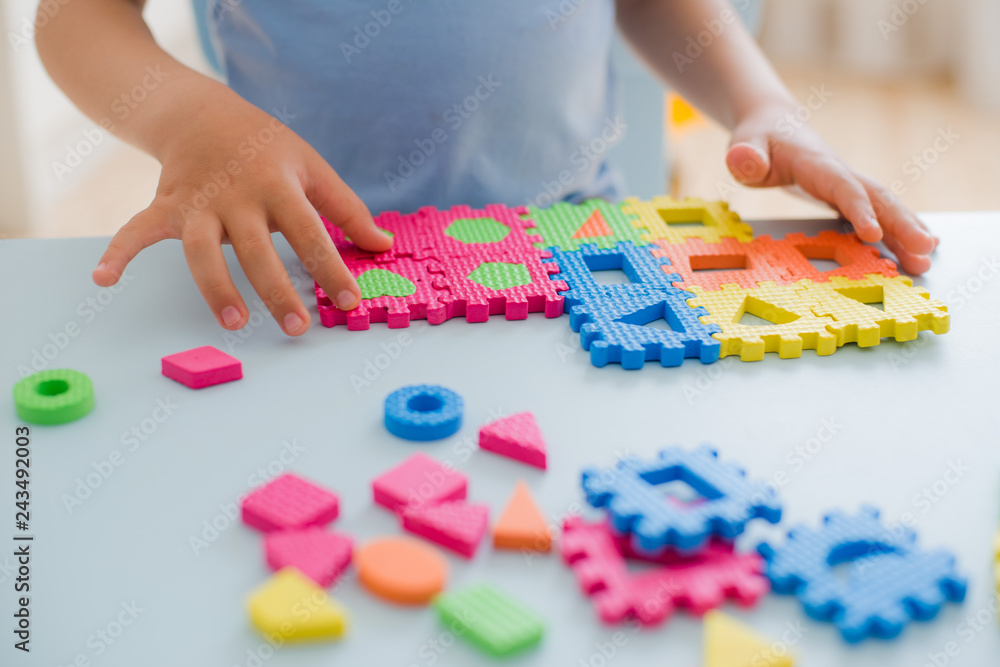 little girl playing with puzzle, early education little girl playing with puzzle, early education