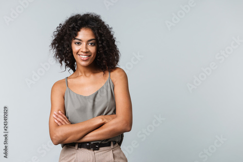 Happy young african woman casualy dressed standing