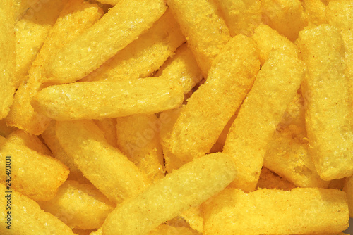 Cheese puffs, Colorful Cheetos. Close up shot of Cheese puffs, background texture