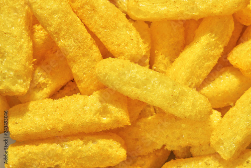 Cheese puffs, Colorful Cheetos. Close up shot of Cheese puffs, background texture