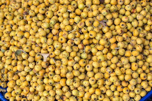 Wild fruit azarole, mediterranean medlar collected and sold in market photo