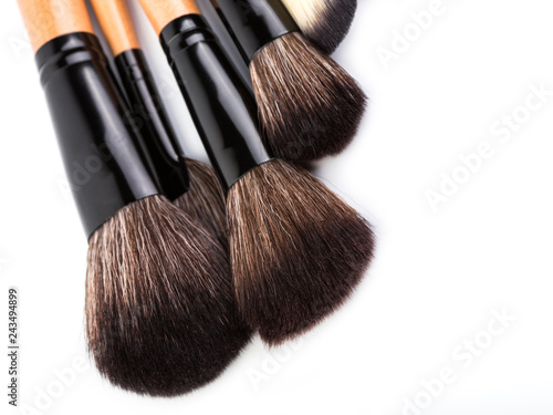 Various makeup brushes isolated over white. wooden makeup brushes. Duo fibre foundation makeup brush. Style. Fashion. Visage. Cosmetics.