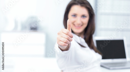 employee shows a thumbs up, sitting at the Desk Free Download employee shows a thumbs up, sitting at the Desk - GFXLoad