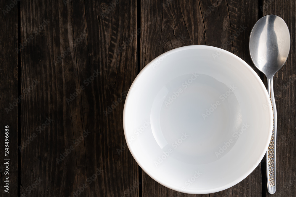 table setting empty white plate with spoon on wooden table table setting empty white plate with spoon on wooden table