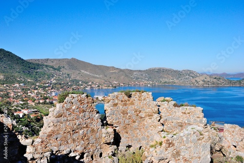 View of Selimiye village and bay from the ruins of an ancient Hydas castle on the Sarıkaya Hill Marmaris resort town in Mugla Province of Turkey photo