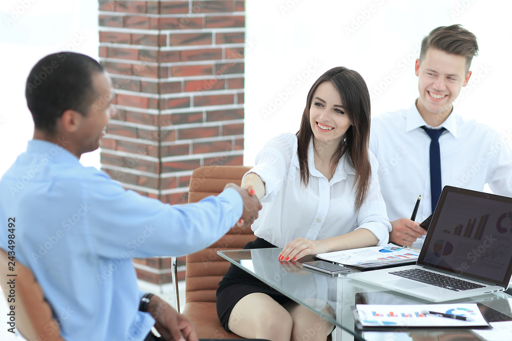 closeup.the handshake of a businessman and investor in the office. closeup.the handshake of a businessman and investor in the office.