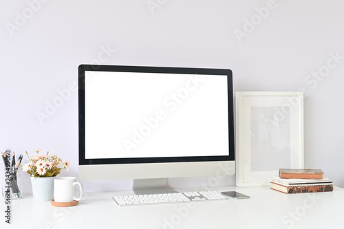 Workspace table office supplies on creative workplace with mockup computer empty display.