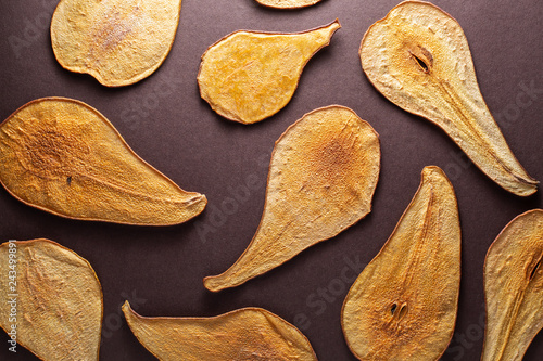 Bild auf Leinwand Slides thinly sliced pears drying in the sun, background